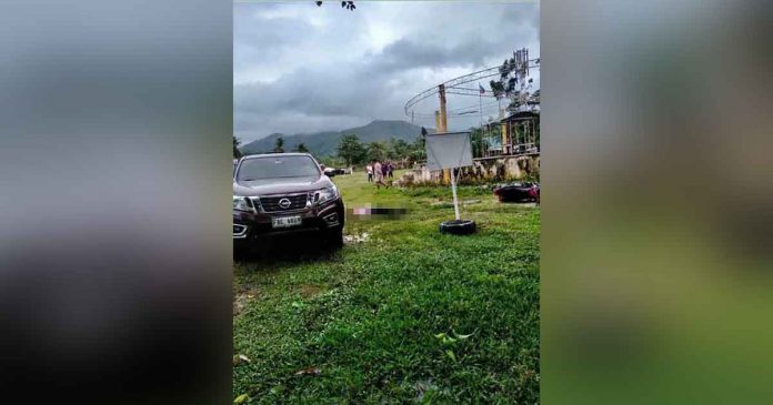 Uybico Bilbao National High School principal Warren Escosar lay dead next to his pickup. He shot himself. Hinoba-an Municipal Police Station photo