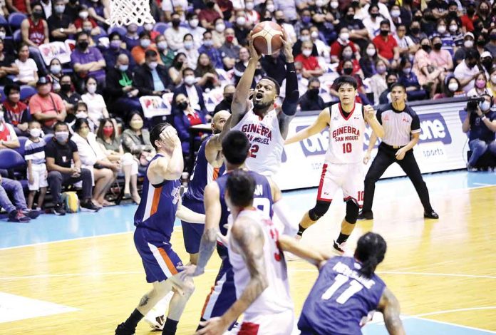 Barangay Ginebra San Miguel Kings’ Justin Brownlee pulls up for a basket while being surrounded by Meralco Bolts’ defenders. PBA MEDIA BUREAU