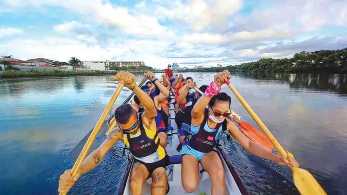 Members of the Iloilo Paddlers Club practice in the Iloilo River.