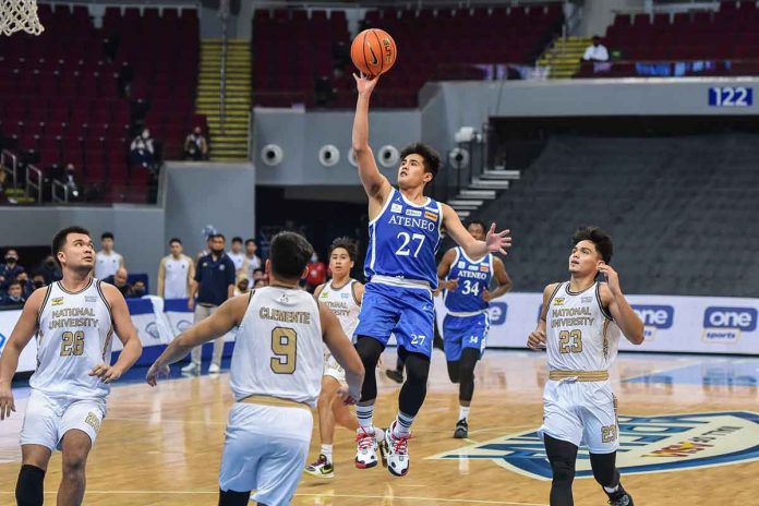 Negrense Samjosef Belangel of Ateneo de Manila University Blue Eagles scores on a floater against the defense of National University Bulldogs. UAAP MEDIA BUREAU