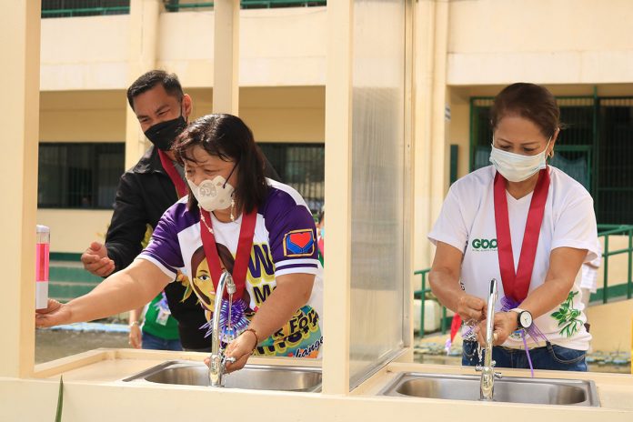 SYNERGY FOR THE SCHOOLS. Leading the turnover of the donated handwashing stations by CEDC and GTFI for the benefit of public school students of Toledo were (from right) Engr. Leah G. Diaz – GBP FVP for Cebu Operations; Mrs. Mae Tacandong, Admin Head of Toledo City; and Mr. Orlando Cadano, Assistant Schools Superintendent of DepEd – Division of Toledo City.