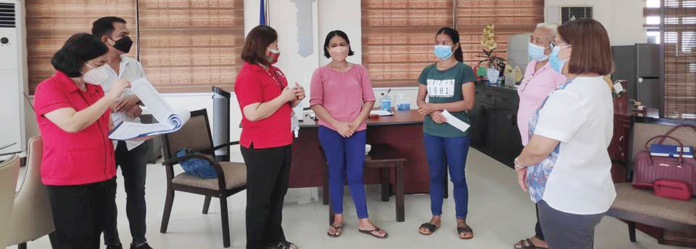 Department of Labor and Employment – Iloilo Field Office chief Melisa Navarra (third from left) discusses with the officers of Manampunay Farmers Association how to make their Rice and Farm Inputs Retailing Project sustainable. DOLE PHOTO