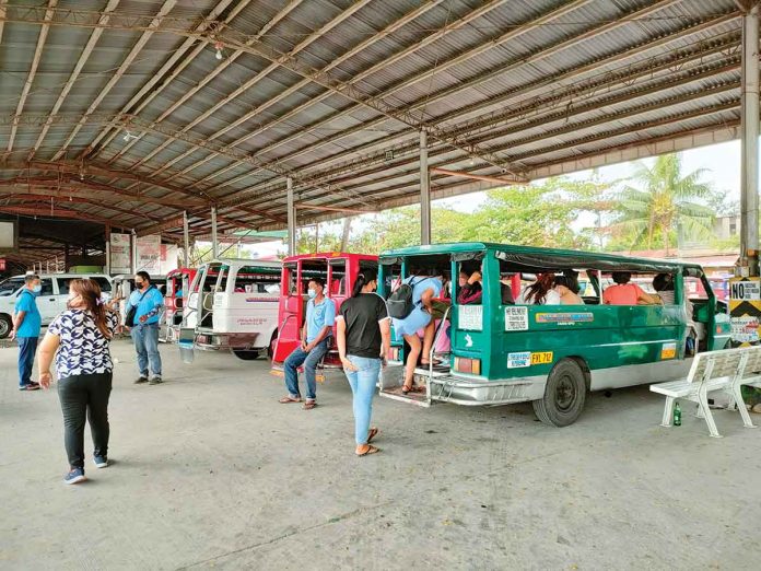 At the transport terminal in Barangay Ungka, Jaro, Iloilo City, drivers wait for their traditional jeepneys to be filled with passengers before leaving. PN PHOTO