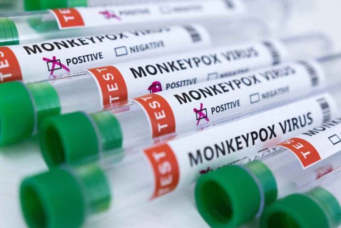 Test tubes labelled “Monkeypox virus positive and negative” are seen in this illustration taken May 23, 2022. REUTERS/DADO RUVIC/ILLUSTRATION