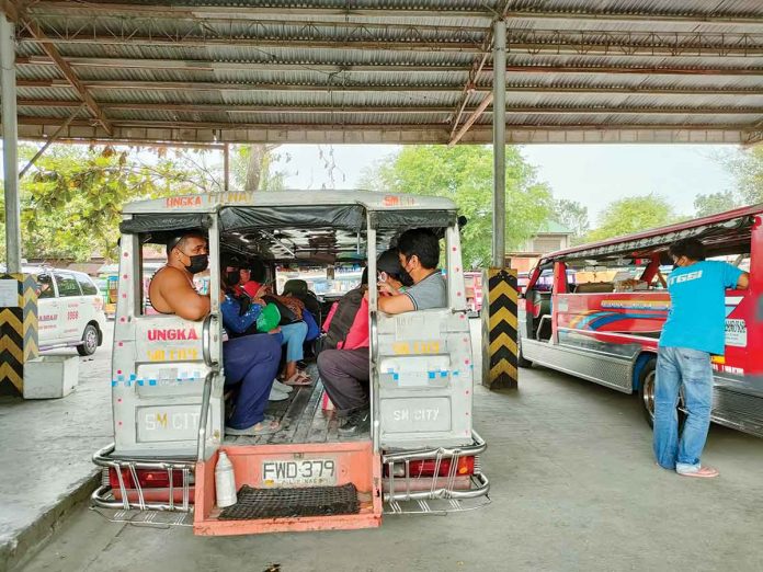 Iloilo City-bound traditional jeepneys wait for passengers at the transport terminal in Barangay Ungka, Jaro district.