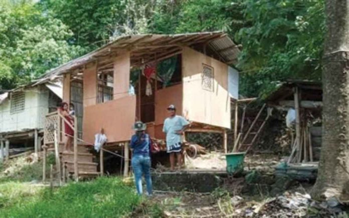 A health worker goes house-to-house campaigning against dengue in the municipality of Sibalom, which has the highest number of dengue cases in the province of Antique. PNA PHOTO COURTESY OF ANTIQUE IPHO