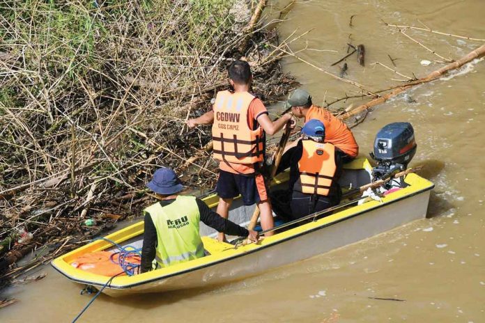 This is one of the search teams looking for a missing ice cream vendor in Mambusao, Iloilo. PHOTO BY CAPIZ PDRRMO