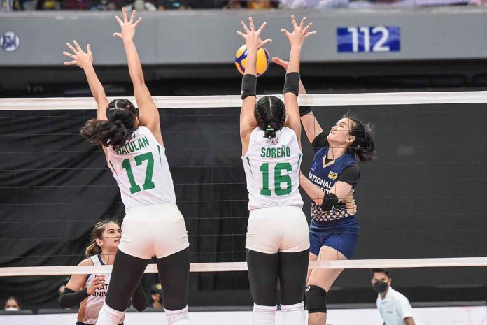 National University Lady Bulldogs’ Mhicaela Belen attempts to score against the defense of De La Salle University Lady Spikers’ Baby Soreno. UAAP MEDIA BUREAU