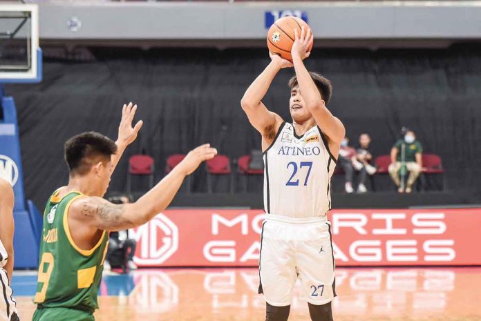 Bacolodnon Samjosef Belangel of Ateneo de Manila University Blue Eagles attempts a basket in front of the defense of Ilonggo John Bryan Sajonia of Far Eastern University Tamaraws. UAAP MEDIA BUREAU