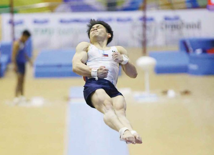 Filipino gymnast Carlos Edriel Yulo is in midair during the vault event of the 31st Southeast Asian Games on Monday. PSC MEDIA PHOTO