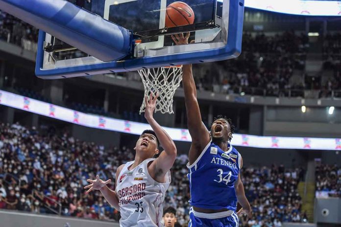 Ateneo de Manila University Blue Eagles’ Angelo Kouame blocks the shot of University of the Philippines Fighting Maroons’ Carl Tamayo. UAAP MEDIA BUREAU