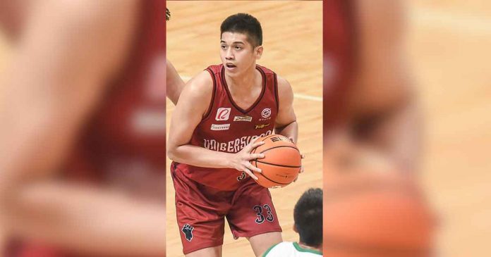 Carl Tamayo carries the fight for the University of the Philippines Fighting Maroons. UAAP MEDIA BUREAU