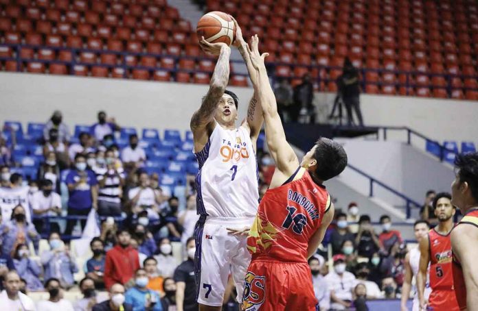 TNT Tropang Giga’s John Paul Erram shoots over the defense of Rain or Shine Elasto Painters’ Mark Borboran. PBA MEDIA BUREAU