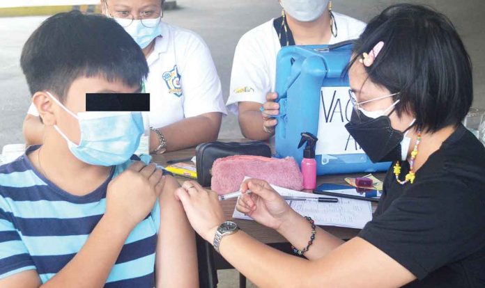 An eligible boy gets his shot of the vaccine against coronavirus disease 2019 in Pavia, Iloilo. The Provincial Health Office urges Ilonggos to get booster shots, particularly the immune-compromised. PN PHOTO