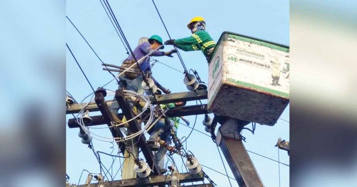 Linemen of MORE Electric and Power Corporation fix power cables in Iloilo City. With continued improvements in MORE Power services, brownouts are significantly reduced. PHOTO FROM MORE POWER FACEBOOK PAGE