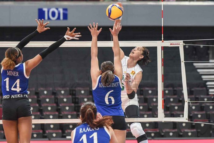 De La Salle University Lady Spikers’ Alleiah Malaluan scores against the defense of Ateneo de Manila University Blue Eagles Jaja Maraguinot. UAAP MEDIA BUREAU