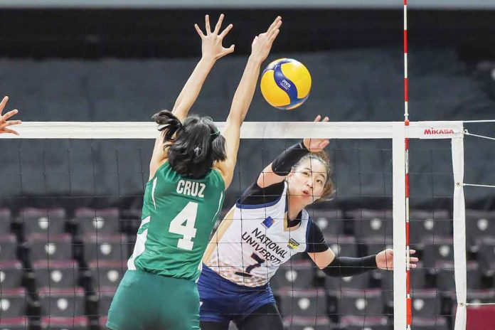 Ilongga Princess Ann Robles of National University Lady Bulldogs attempts to score against the defense of De La Salle University Lady Spikers’ Leila Cruz. UAAP MEDIA BUREAU