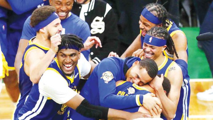 The Warriors are emotional after winning their first title since 2018. AP