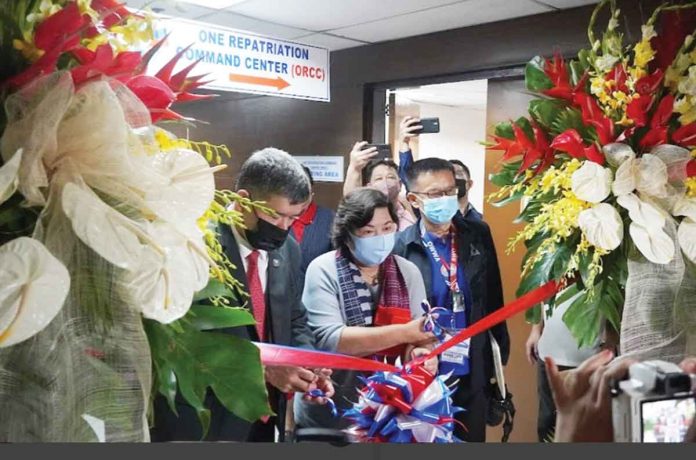 The One Repatriation Command Center of the Department of Migrant Workers (DMW) has been formally opened. From left: Department of Foreign Affairs undersecretary Eduardo Jose De Vega, DMW secretary Susan “Toots” Ople and Overseas Workers Welfare Administration’s Administrator Hans Leo Cacdac.