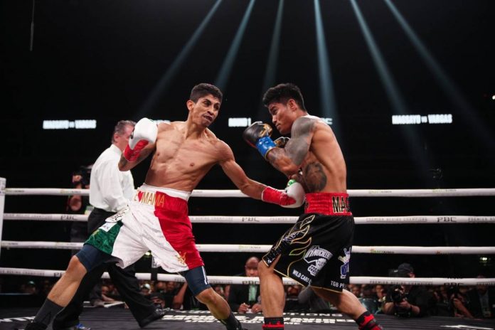 Mexican Rey Vargas (left) lands a left hook to the body of Filipino fighter Mark Magsayo. SHOWTIME PHOTO