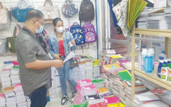 Trade and Industry Development Specialist Glen Fernando monitors the prices of school supplies in a store in San Jose, Antique. PHOTO COURTESY OF DTI-ANTIQUE