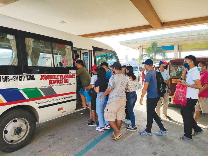 Iloilo City-bound passengers board a modernized jeepney at the transport terminal in Barangay Tagbak, Jaro district. Under the Local Public Transport Route Plan, provincial jeepneys are prohibited from entering the city. ARNEL JOHN PALCULLO/PN