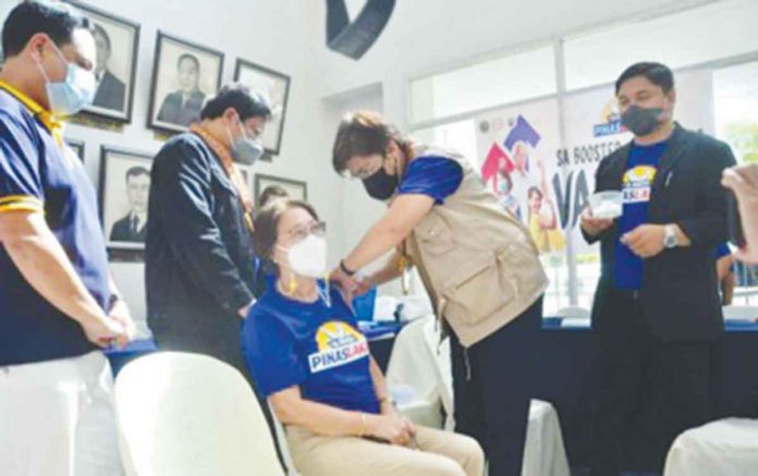 Department of Health officer-in-charge Undersecretary Maria Rosario Vergeire administers a COVID-19 vaccine to a recipient during the launching of “Bakas para sa PinasLakas” program of Iloilo province held at the provincial capitol on Aug. 24, 2022. PHOTO COURTESY OF BALITA HALIN SA KAPITOLYO