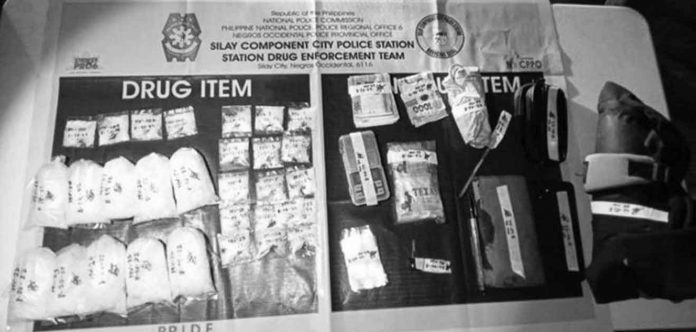 Police seized these 10 knot-tied bags and 20 plastic sachets of suspected shabu with a combined weight of 1.1 kilograms and valued at P7,561,600 in Sily City, Negros Occidental. PRO-6 PHOTO