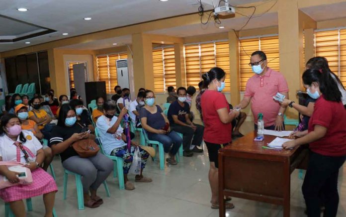 Individuals in crisis situation receive financial assistance from the Municipal Social Welfare and Development Office and Municipal Treasurer's Office of San Jose, Antique. PHOTO FROM THE FACEBOOK PAGE OF MAYOR ELMER UNTARAN