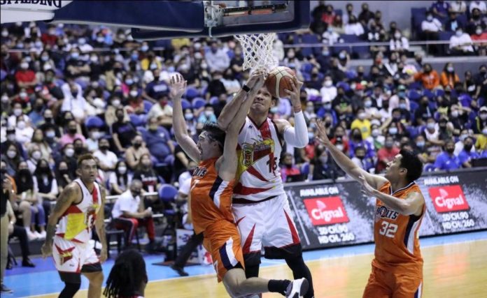 San Miguel Beermen’s June Mar Fajardo brushed off Meralco Bolts' Clifford Hodge to take the rebound. PBA MEDIA BUREAU