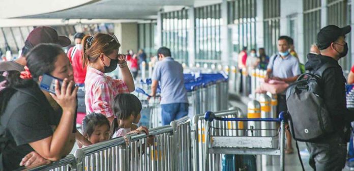 Loved ones bid goodbye to departing passengers at the Ninoy Aquino International Airport -Terminal 1 in Pasay City on June 20, 2022. JONATHAN CELLONA/ABS-CBN NEWS