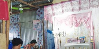 Photo shows the wake of four-month-old Baby Amara, one of the 10 fatalities due to acute gastroentiritis in Iloilo City. She was being watched by her two older brothers in their home in Barangay Tanza Timawa Zone 2, Iloilo City.