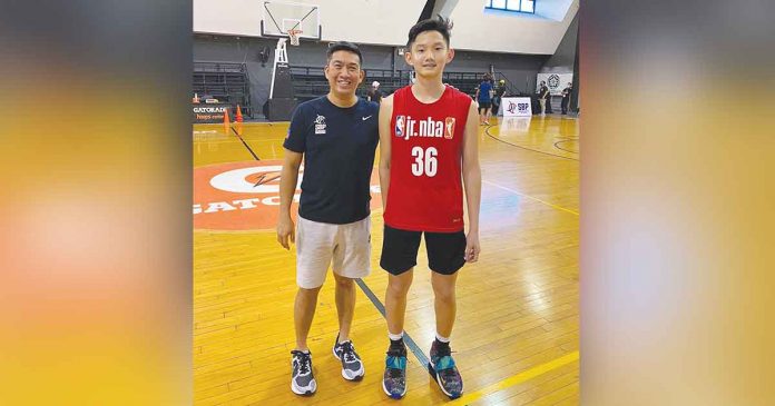 Bacolodnon Paul Barcelona (right) with JR. NBA Manila coach Mark Solano. CONTRIBUTED PHOTO