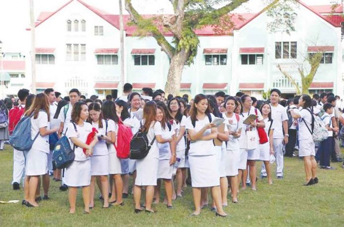 College students of the Central Philippine University in Jaro, Iloilo City at their football field. CPU EDUCATIONAL MEDIA CENTER