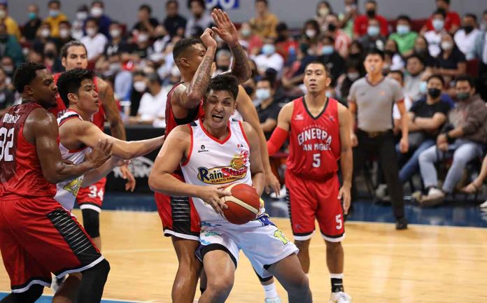 Rain or Shine Elasto Painters’ Jewel Ponferrada protects the ball while being defended by Barangay Ginebra San Miguel Kings’ Jamie Malonzo. PBA PHOTO