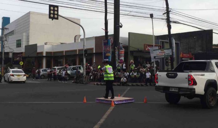 Photo shows yesterday's (October 5) elimination round of the 2022 "Dancing Traffic Enforcers" competition at Corner Lacson St., BS Aquino Drive.