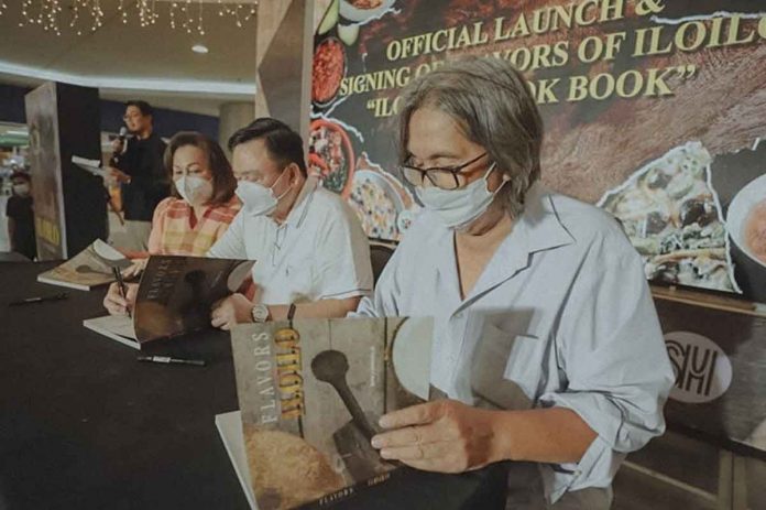 FLAVORS OF ILOILO. (From left) Iloilo City’s first lady Rosalie S. Treñas, Mayor Jerry P. Treñas and Ilonggo heritage cuisine advocate chef Rafael “Tibong” Jardeleza Jr. sign copies of the Ilonggo cookbook “Flavors of Iloilo” during its launching at SM City Iloilo on Oct. 14, 2022. JERRY TREÑAS FACEBOOK PAGE PHOTO