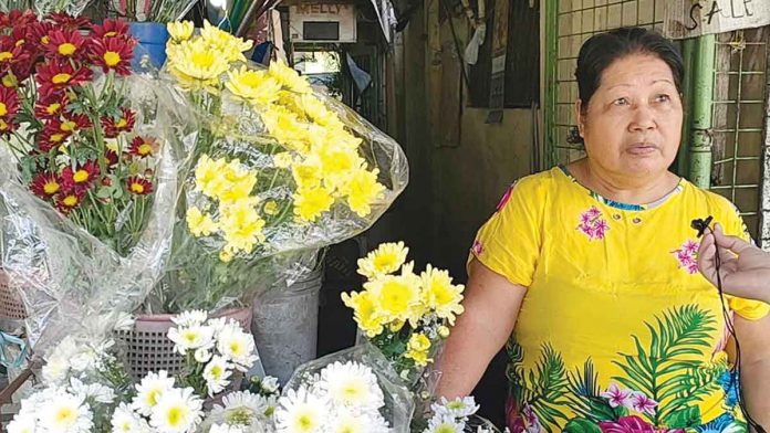 Leonora Tuvillea, flower shop owner in Arevalo, Iloilo City, says there are no changes in the prices of flowers as of Thursday, Oct. 27. But she is concerned that prices may increase ahead of Nov. 1 and 2 due to the inclement weather and the spike in demand. AJ PALCULLO/PN