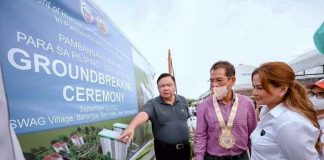 USWAG TOWNSHIP DEV’T. Iloilo City’s Mayor Jerry Treñas shows the perspective of the two 10-storey housing condominiums dubbed “Uswag Township Development” (Uswag Village) to Department of Human Settlements and Urban Development secretary Jose Rizalino L. Acuzar as Cong. Julienne Baronda looks on during the groundbreaking in Barangay San Isidro, Jaro district. ILOILO CITY MAYOR’S OFFICE PHOTO