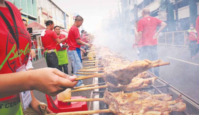 Savor even just by smelling. Not only the activities during Masskara Festival fill the streets of Bacolod City but also smoke coming from rows and rows of charcoal-grilled Bacolod chicken inasal. (PN File Photo)