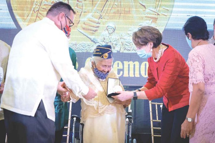 US Ambassador to the Philippines MaryKay Carlson leads the awarding of the Congressional Gold Medal to one of 31 Filipino World War II veterans who received the honor on Oct. 19, 2022 in Palo, Leyte. US EMBASSY PHOTO