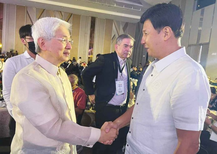 Roxas City mayor Ronnie Dadivas meets Department of Trade and Industry Secretary Alfredo Pascual (left) during the City Business Investors Summit 2022 in Quezon City. RONNIE DADIVAS/FB PHOTO