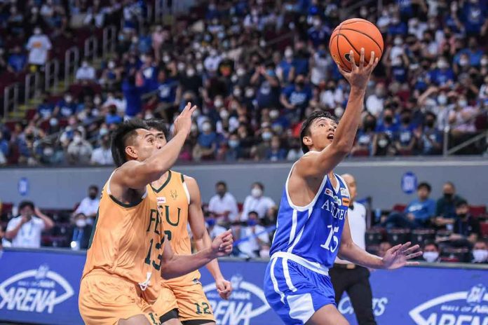 Ateneo de Manila University Blue Eagles’ Rence Padrigao goes for an inside basket after evading the defense of Far Eastern University Tamaraws’ Louell Jay Gonzales. UAAP MEDIA BUREAU PHOTO