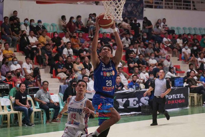 Jhan McHale Nermal of Bacolod BingoPlus skies for a layup as GenSan Warriors’ Dhon Reverente tried to give chase. MPBL PHOTO