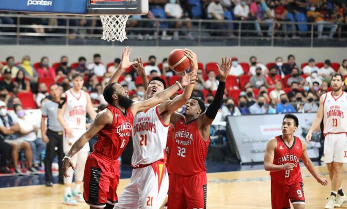 Barangay Ginebra San Miguel Kings’ guard Stanley Pringle swipes the ball from Bay Area Dragons’ 7-foot-5 center Liu Chuanxing. PBA MEDIA BUREAU