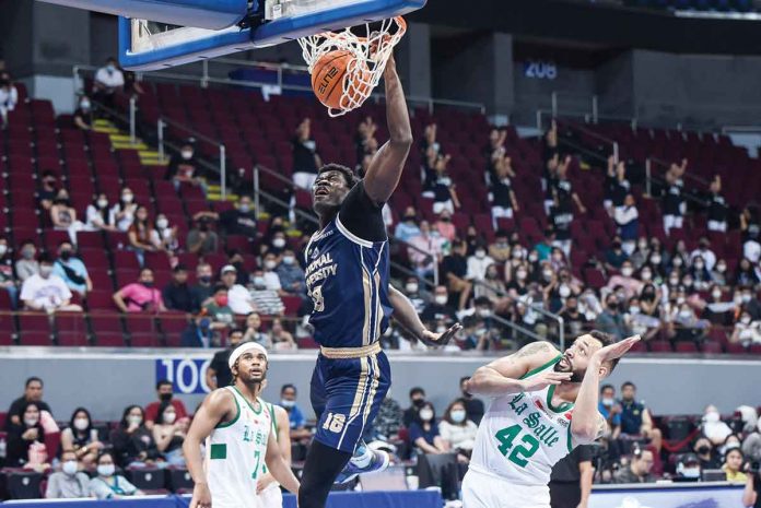 National University Bulldogs center Omar John flies for a one-handed dunk. UAAP MEDIA BUREAU