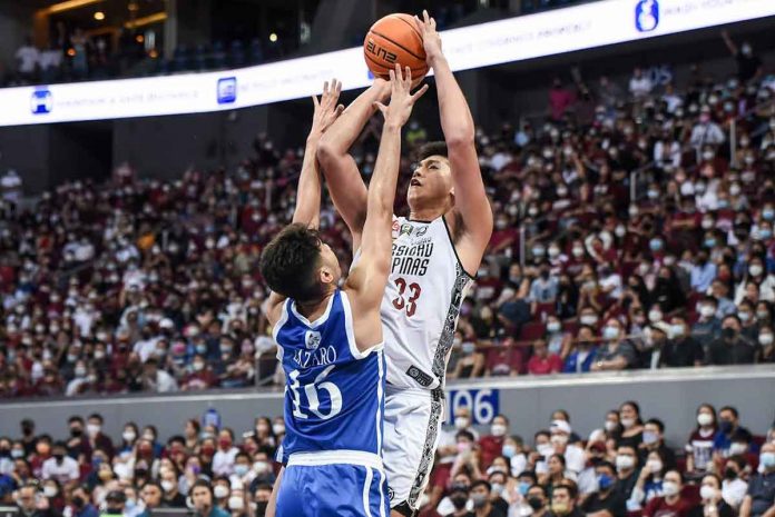 University of the Philippines Fighting Maroons’ Carl Tamayo attempts a tough jumper against the defense of Ateneo de Manila University Blue Eagles’ Josh Lazaro. UAAP MEDIA BUREAU