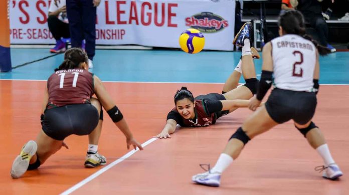 Negrense Nikha Cabasac of University of the Philippines Fighting Maroons saves the ball as two of her teammates look on. PHOTO COURTESY OF SHAKEY’S SUPER LEAGUE