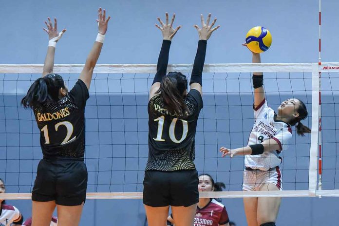 Bacolodnon Joan Marie Monares of University of the Philippines Fighting Maroons positions for an attack against University of Santo Tomas Golden Tigresses’ Camille Victoria. V-LEAGUE PHOTO