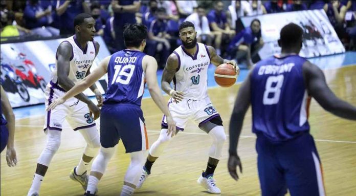 Maverick Ahanmisi carries Converge FiberXers past Meralco Bolts with his clutch three-pointers. PBA MEDIA BUREAU